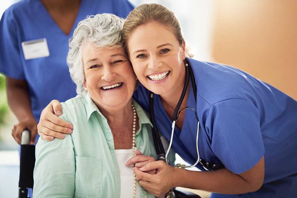 An older adult and family member discussing daily routines together in a cozy living room.